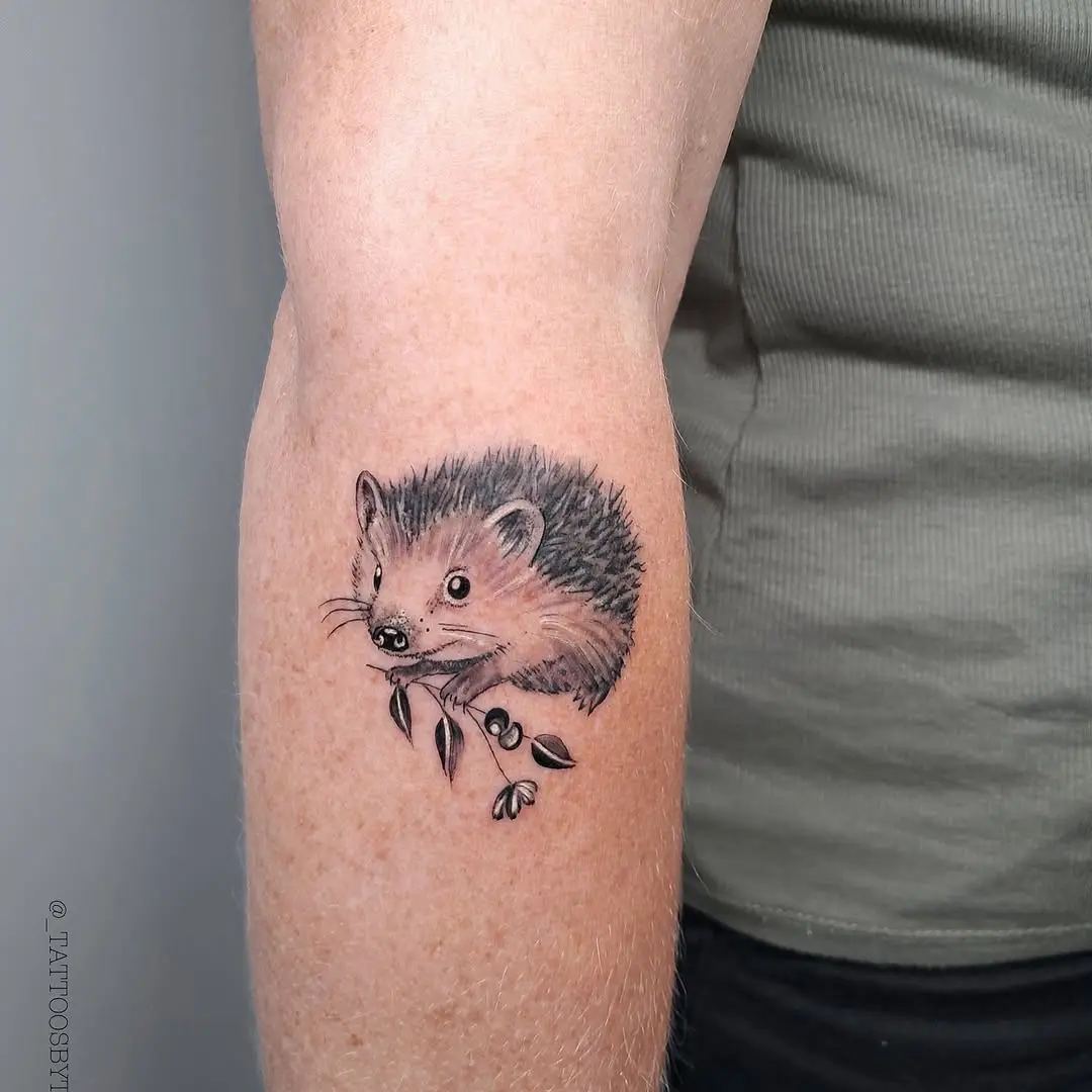 Cute hedgehog tattoo embracing nature's charm