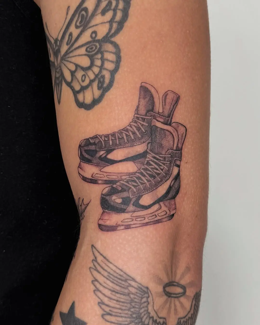 Stylish hockey skates tattoo with unique design