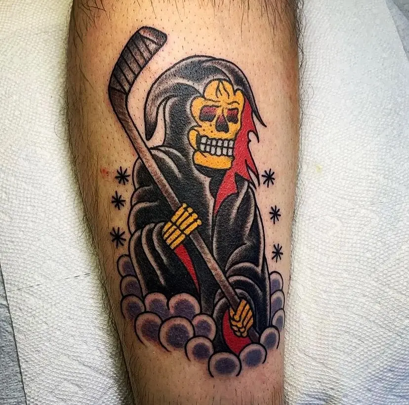 Striking hockey reaper tattoo with vibrant colors