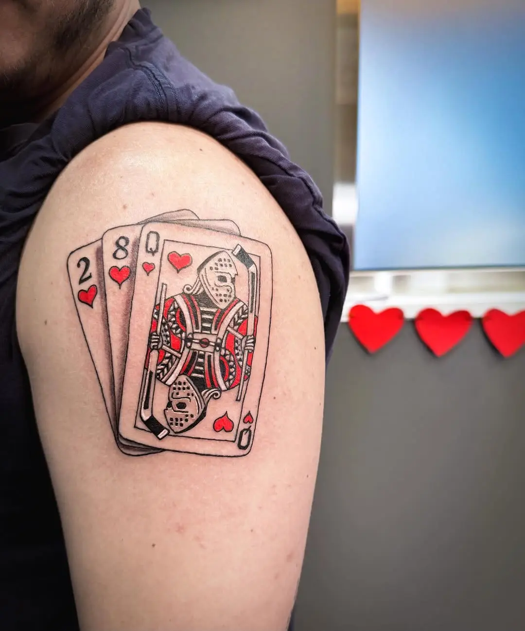Unique hockey cards tattoo with heart elements