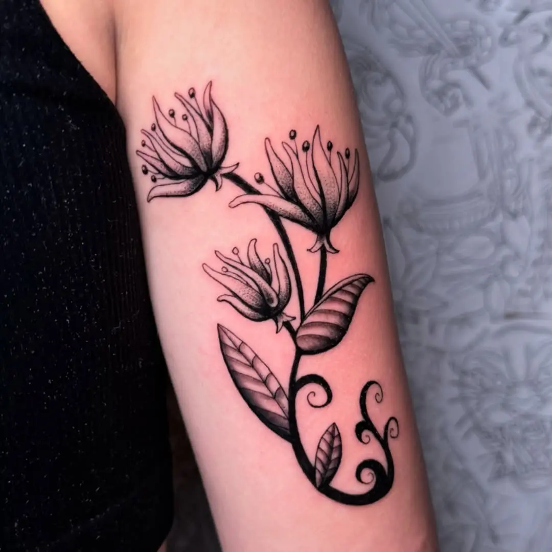 Elegant honeysuckle floral tattoo design for arm