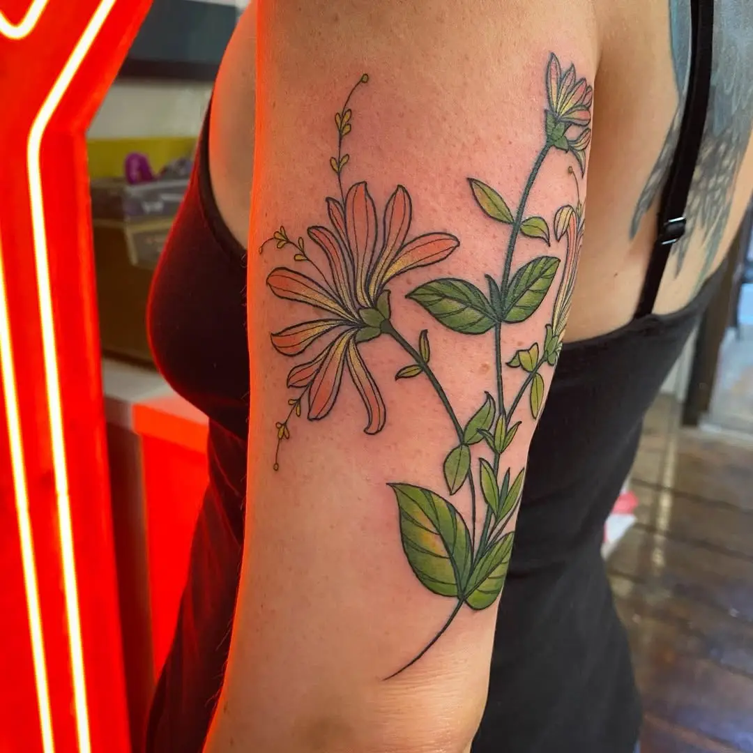 Elegant Honeysuckle Tattoo with Lush Greenery