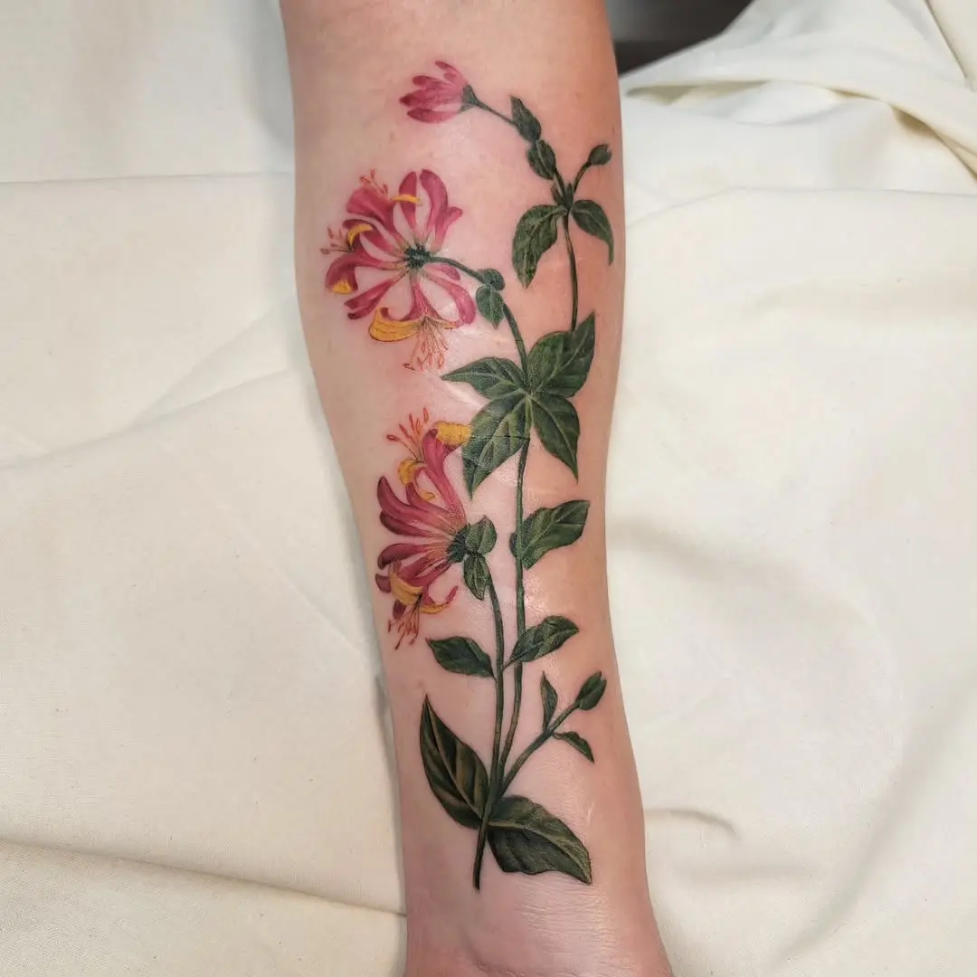 Vibrant honeysuckle tattoo showcasing natural beauty