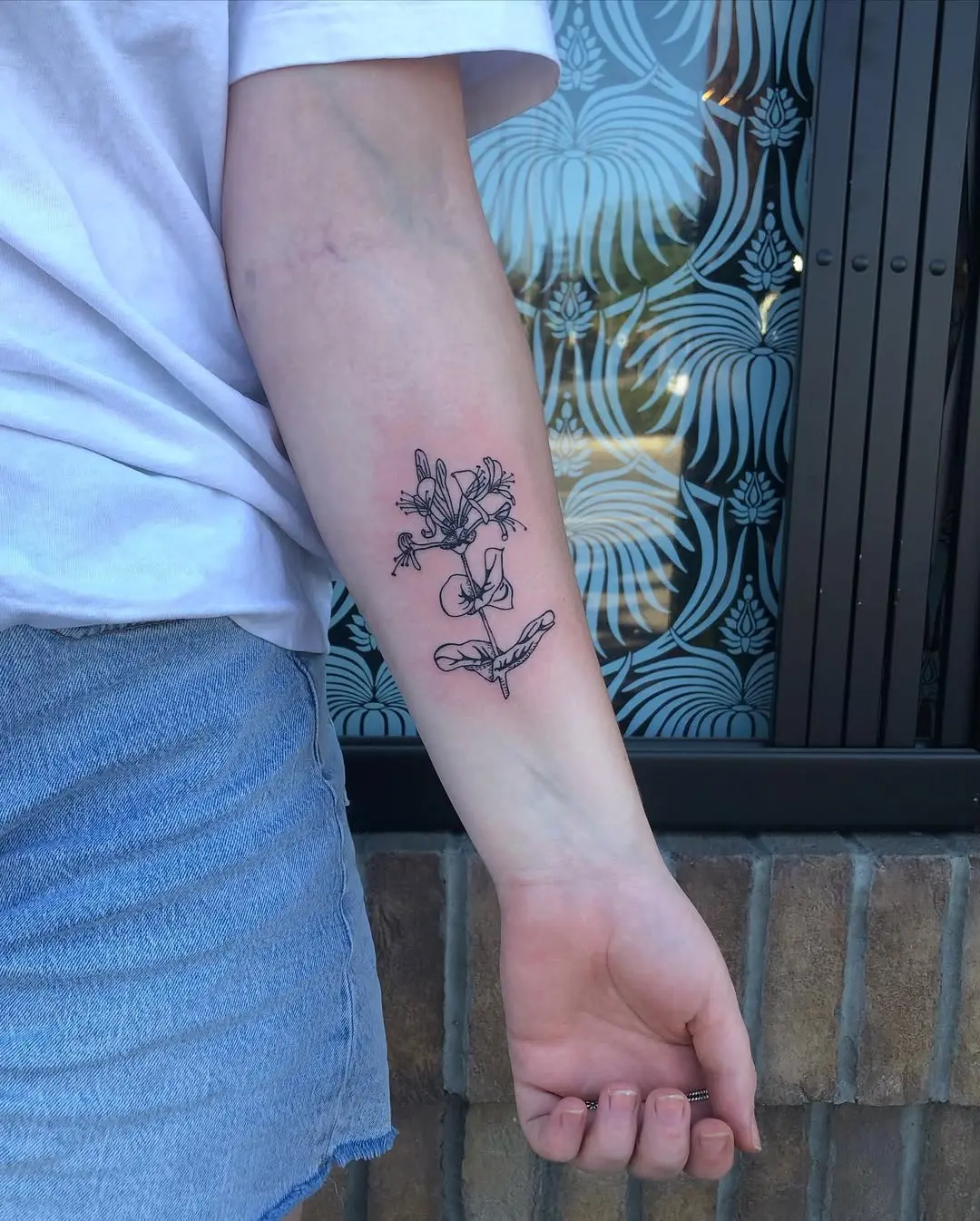 Stylish Honeysuckle Tattoo with Delicate Details