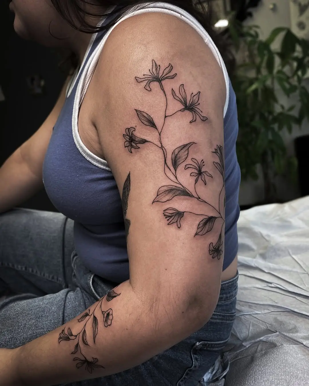Elegant honeysuckle tattoo beautifully adorning the arm