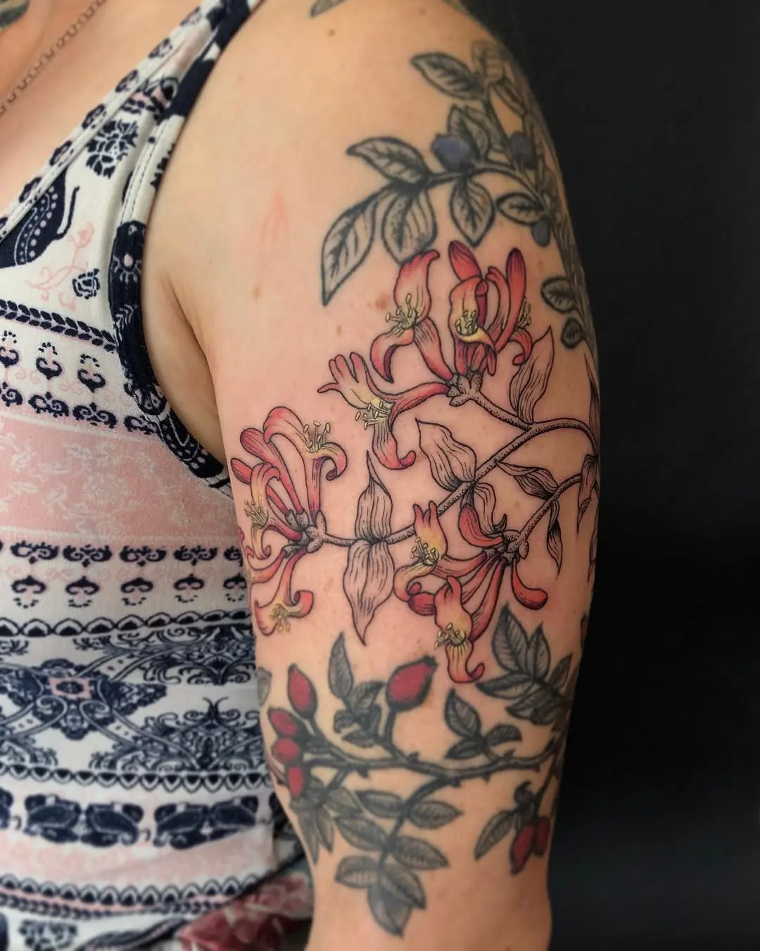 Vibrant Honeysuckle Tattoo on an Arm