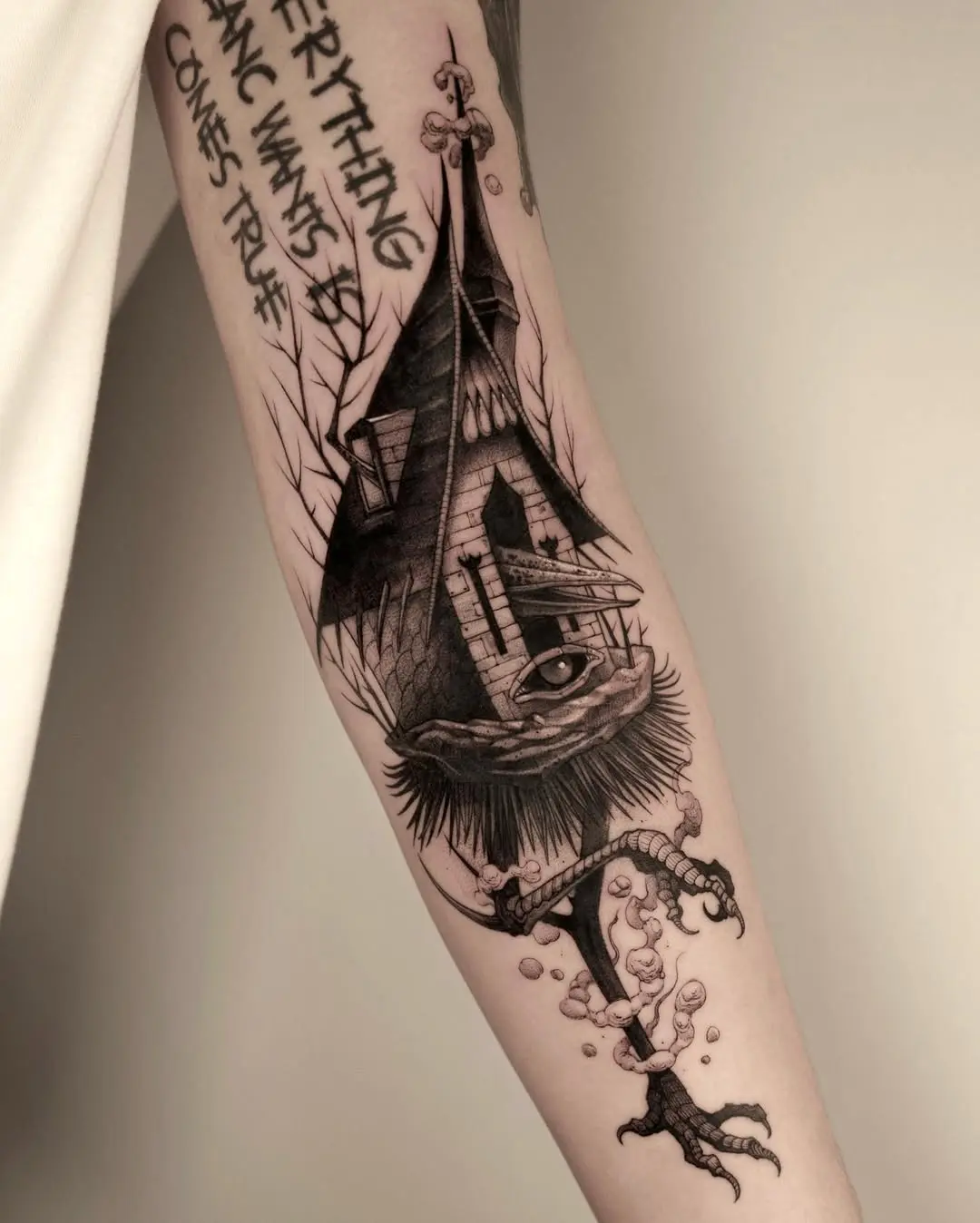 Whimsical house tattoo with an eye motif