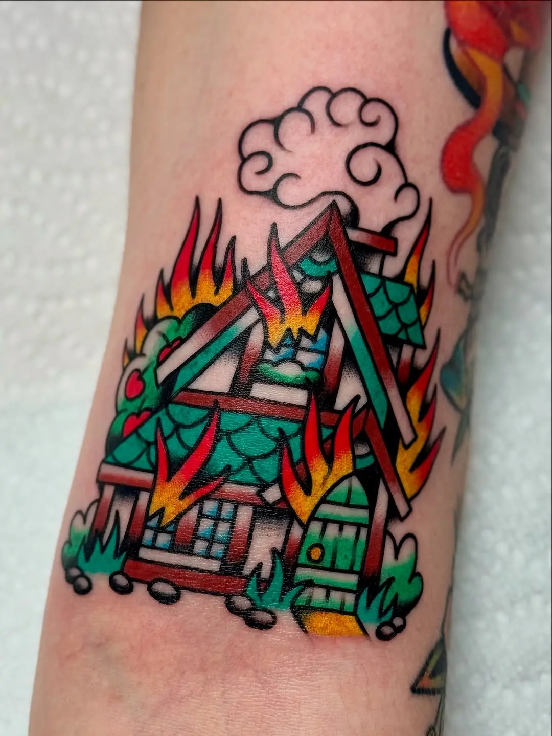 Vibrant House Tattoo with Fiery Flames