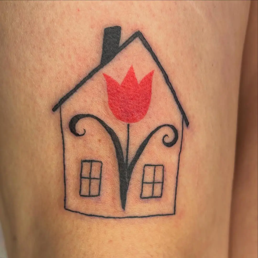 Whimsical house tattoo with vibrant flower