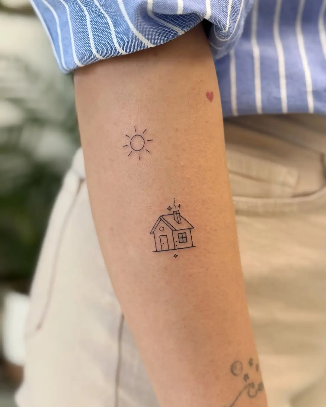 Charming minimal house tattoo with sun