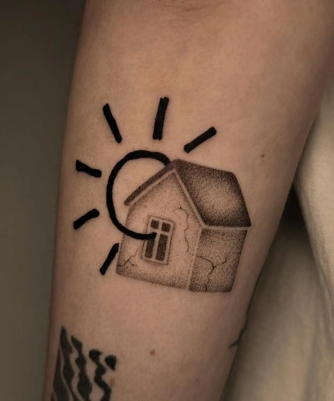 Unique house tattoo with sunburst detail