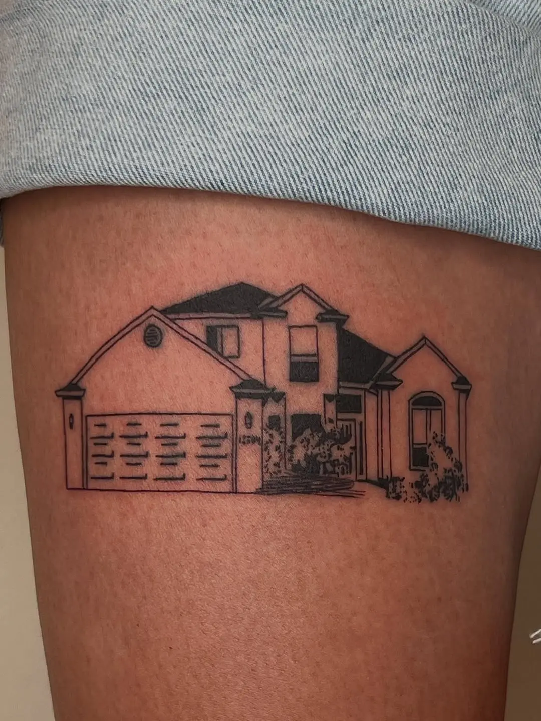 Stylish house tattoo blending art and memory