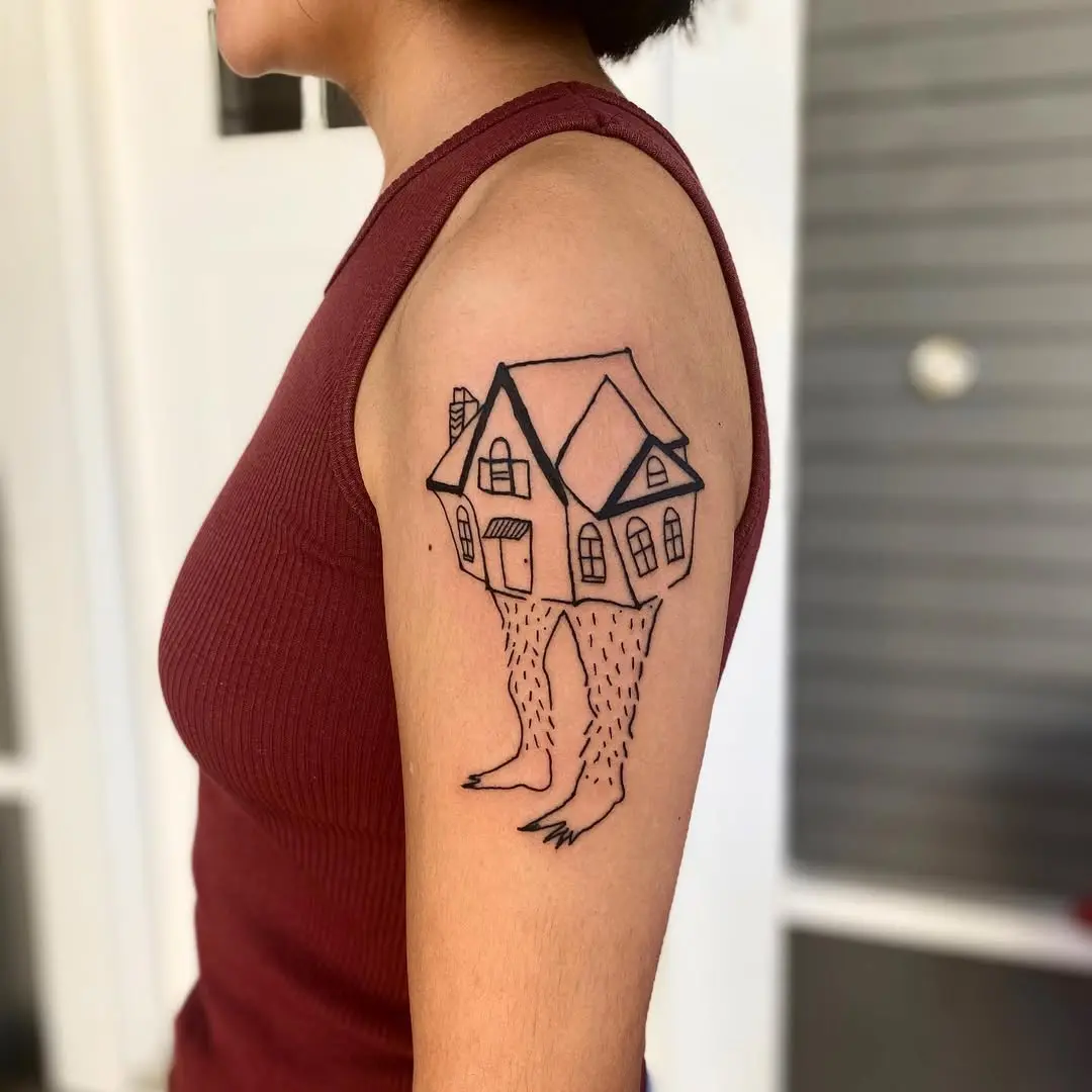 Whimsical house tattoo with playful legs