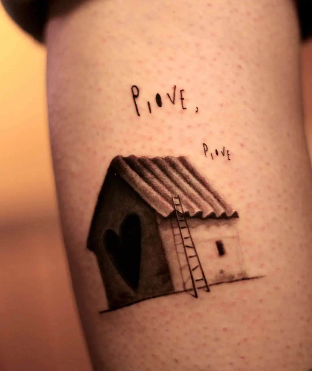 Charming house tattoo with heart design