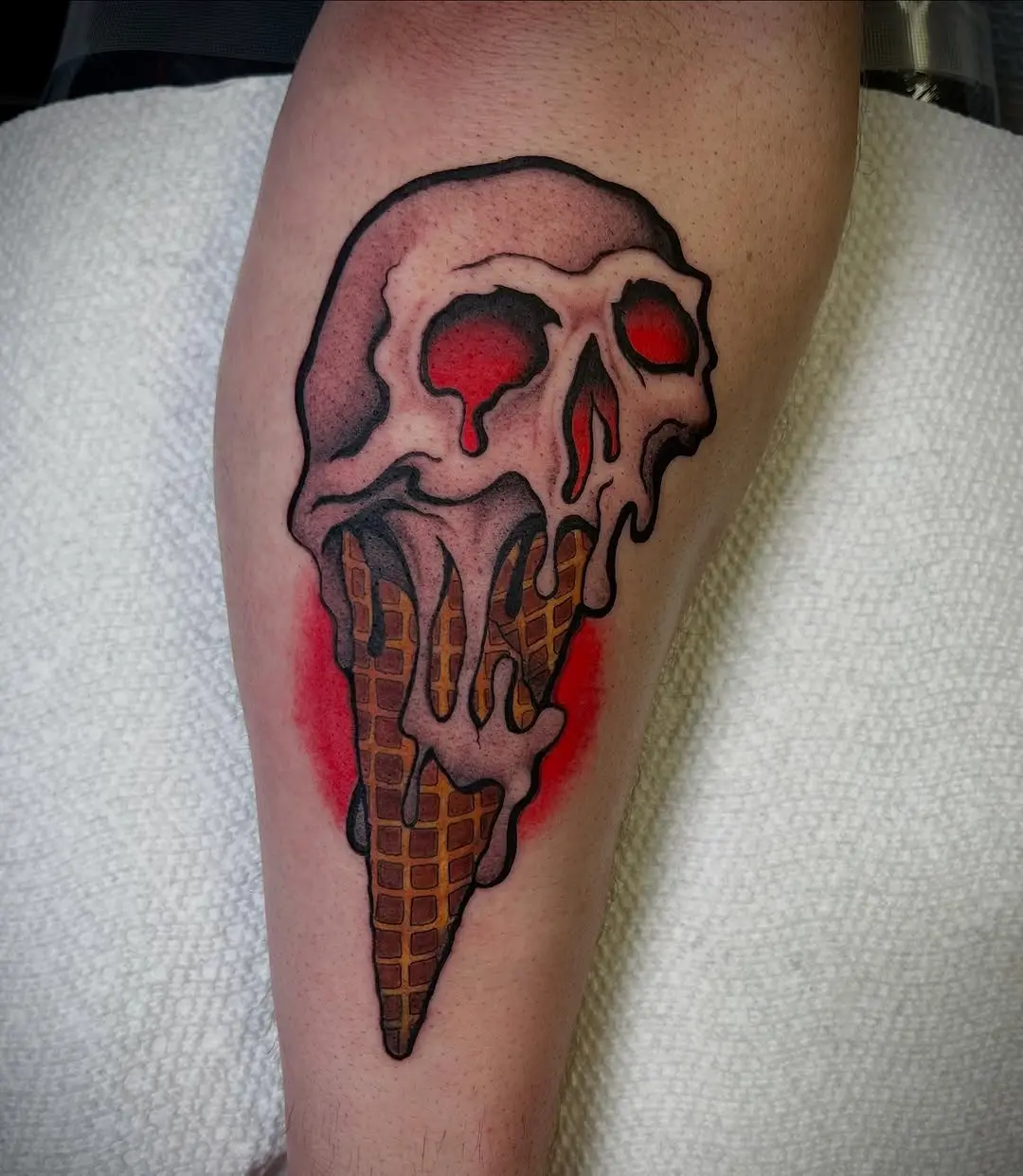 Chilling skull ice cream cone tattoo design
