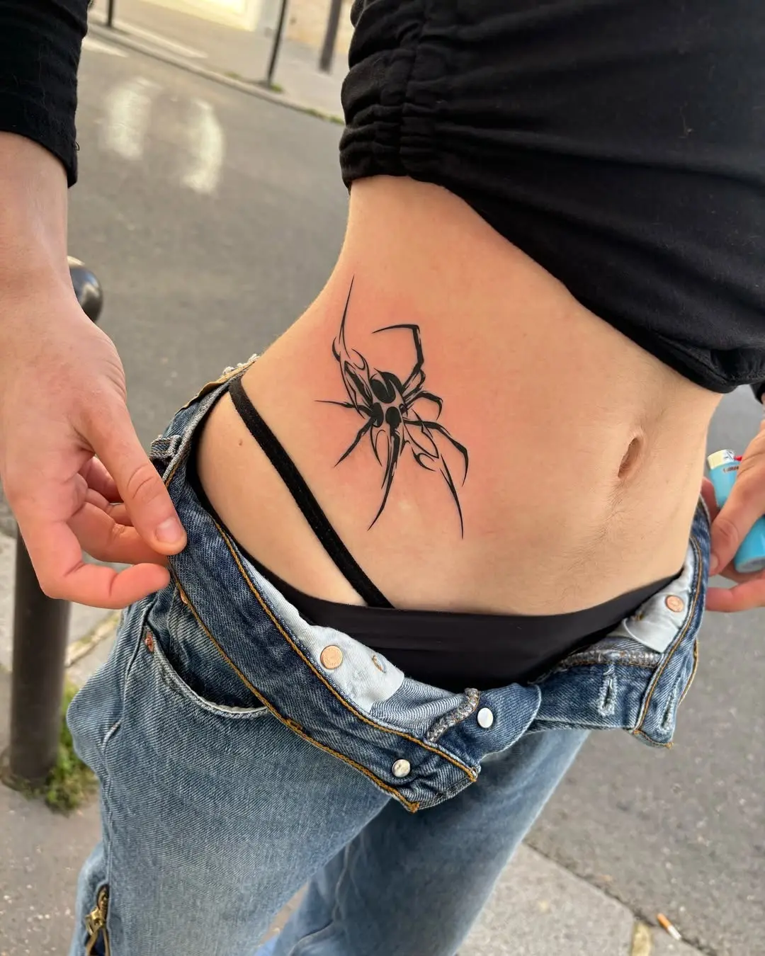 Stunning black spider tattoo on side body