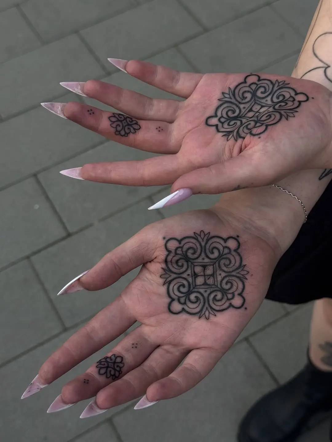 Elegant palm tattoos showcase unique artistry.