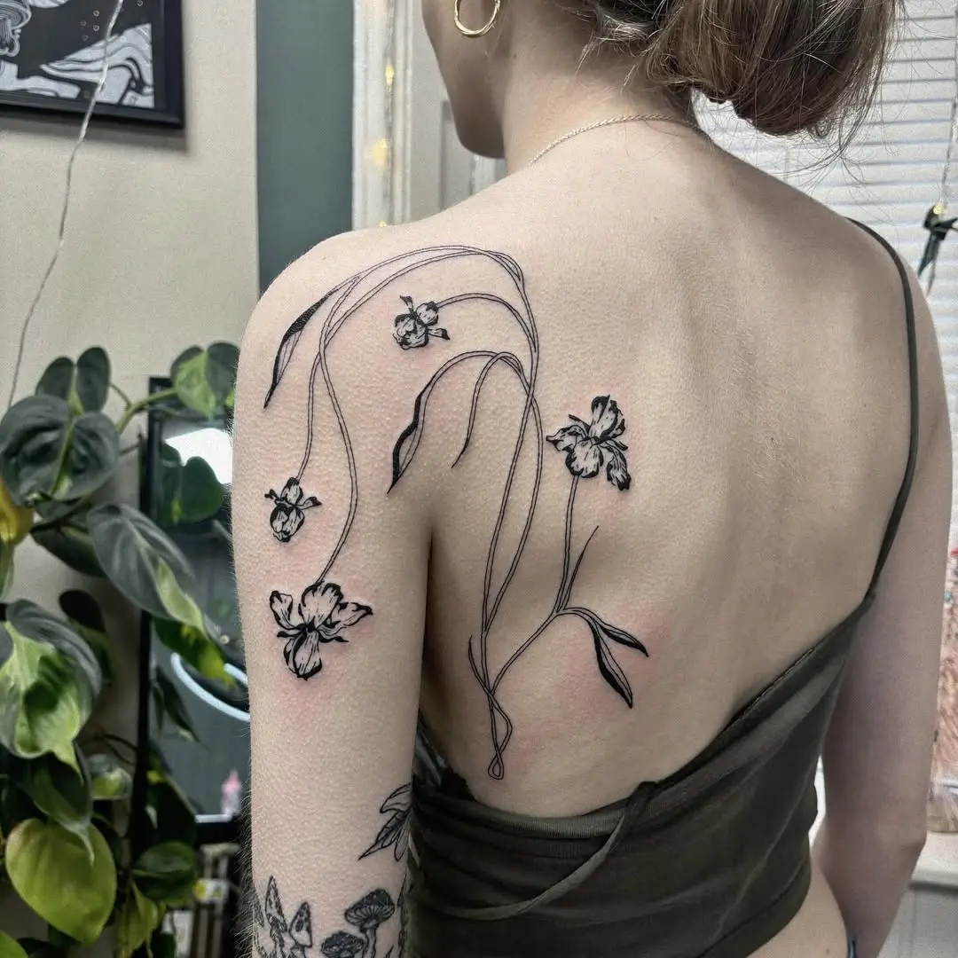Elegant Iris Tattoo on Upper Back