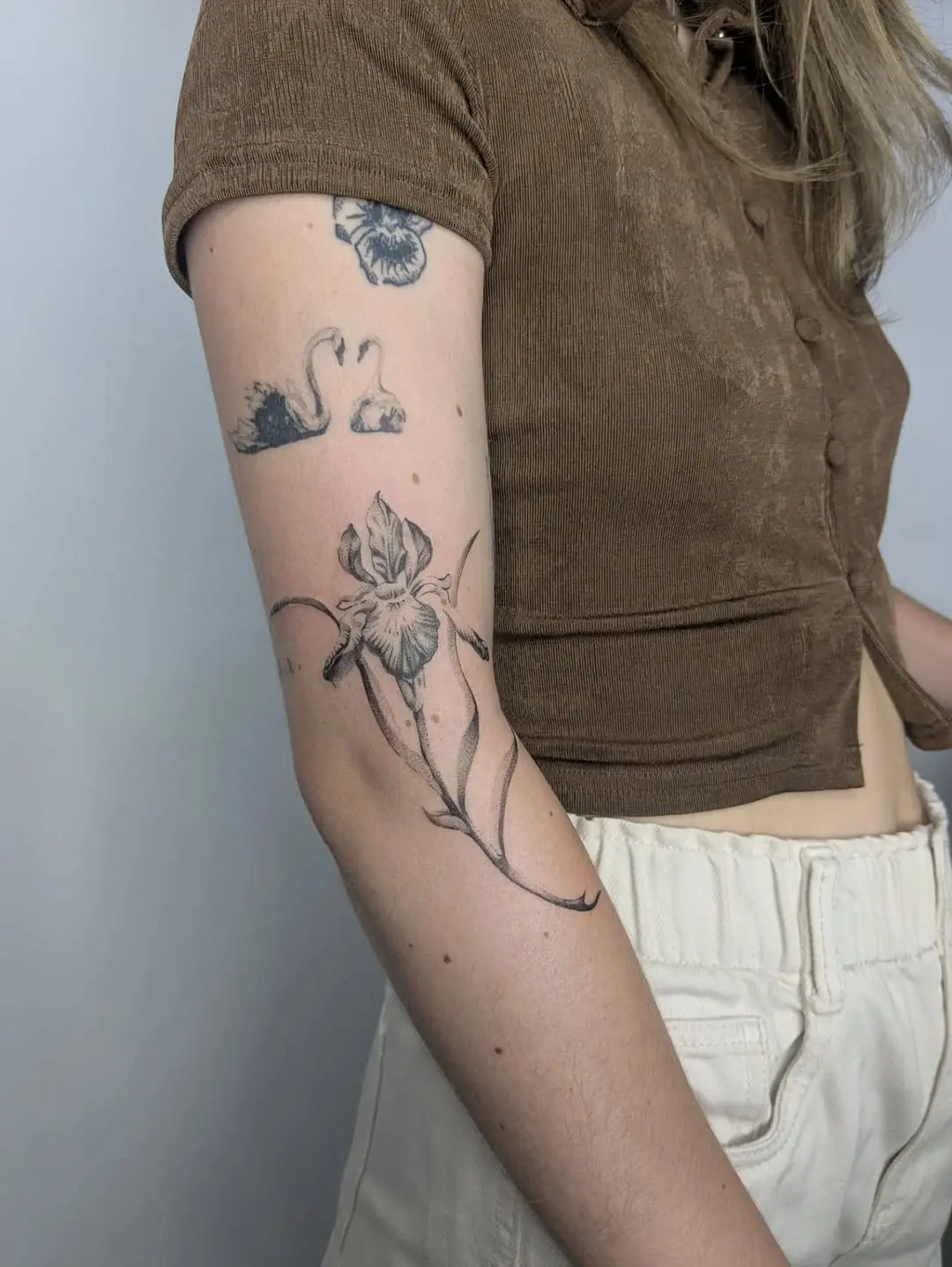 Elegant iris tattoo showcasing delicate artistry
