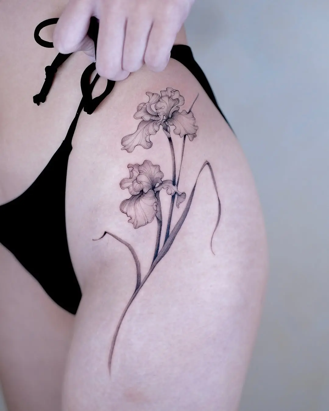 Elegant iris tattoo showcasing delicate artistry