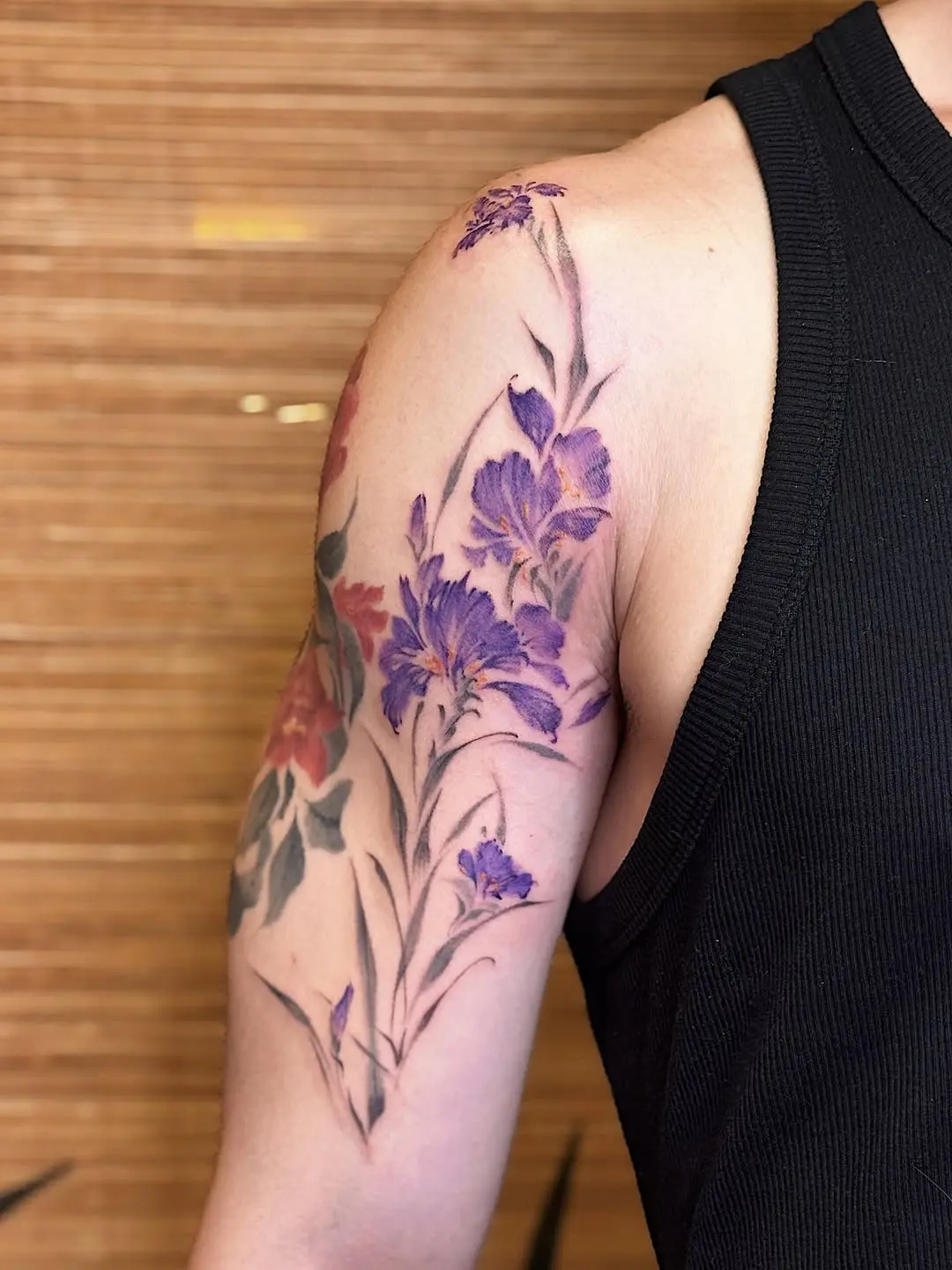 Vibrant Iris Tattoo with Floral Elements