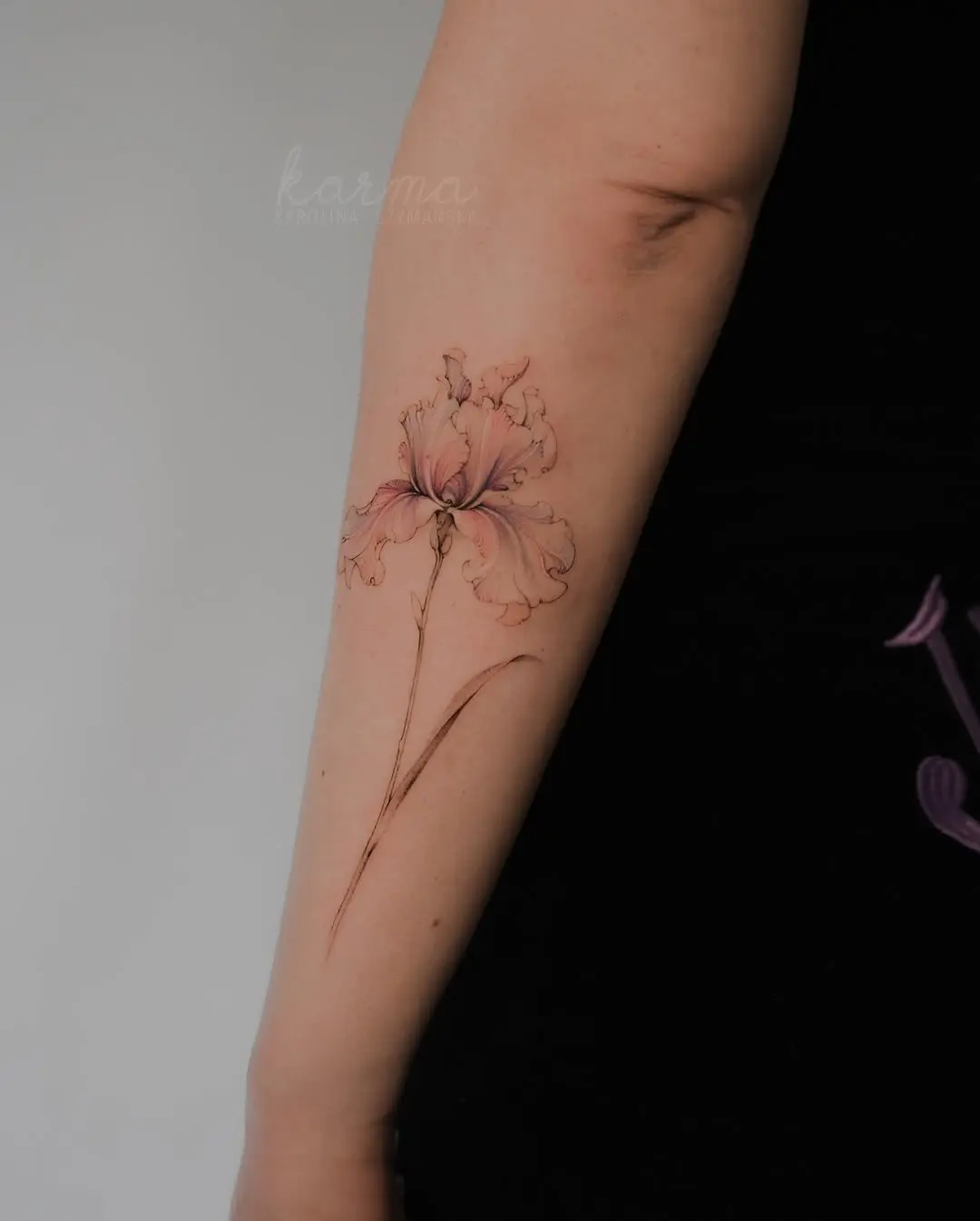 Delicate floral iris tattoo on forearm design