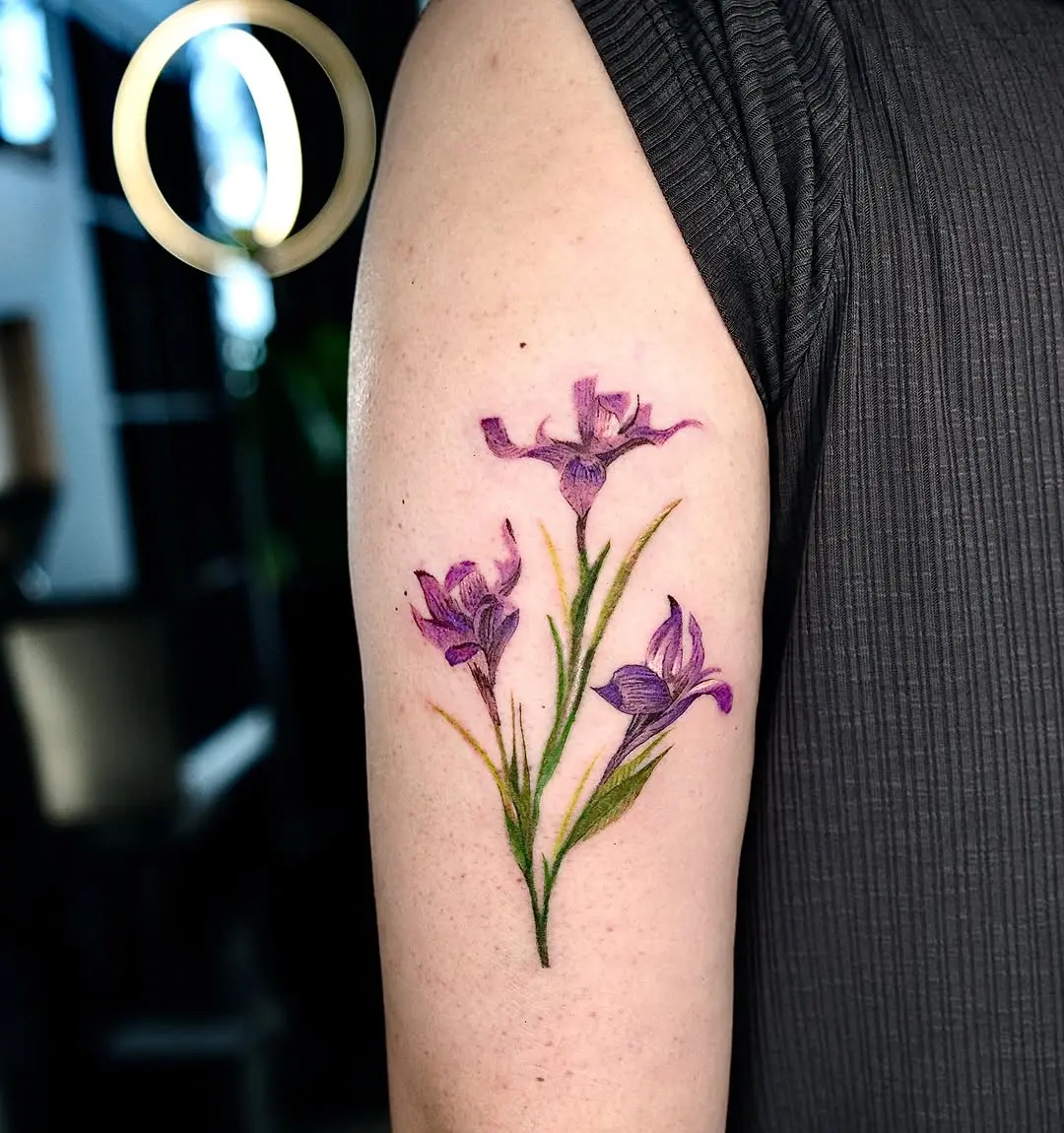 Vibrant floral iris tattoo showcasing natural beauty