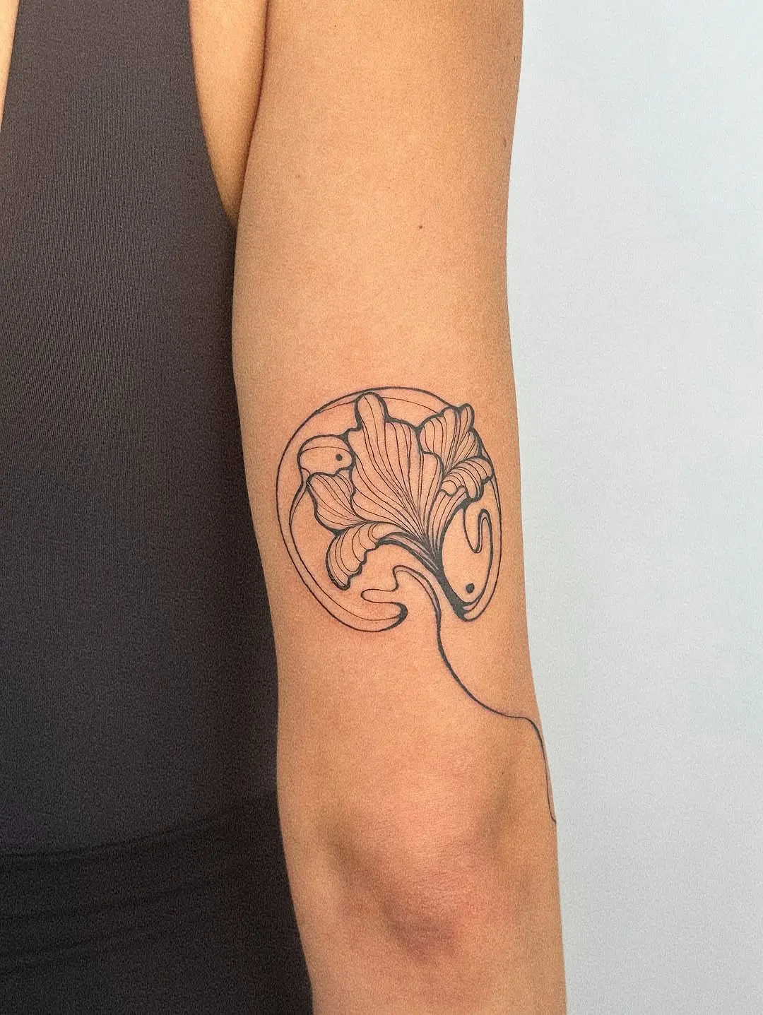 Elegant iris tattoo on the forearm.