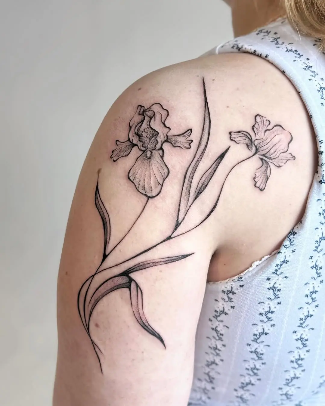 Elegant Iris Tattoo on the Shoulder