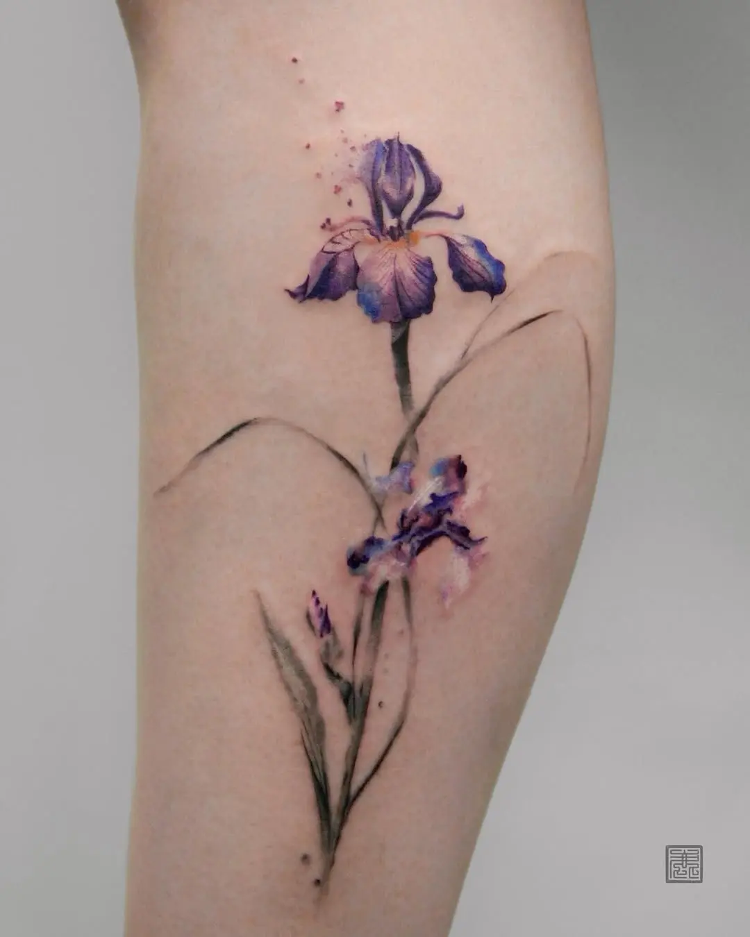 Stunning watercolor iris tattoo design on skin