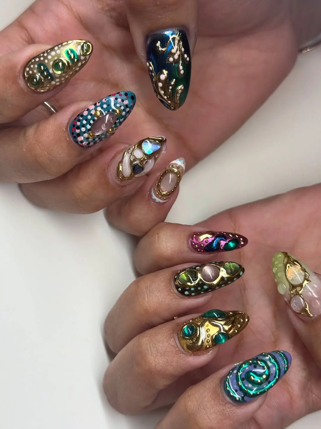 Vibrant Japanese Nail Art with Unique Gem Details