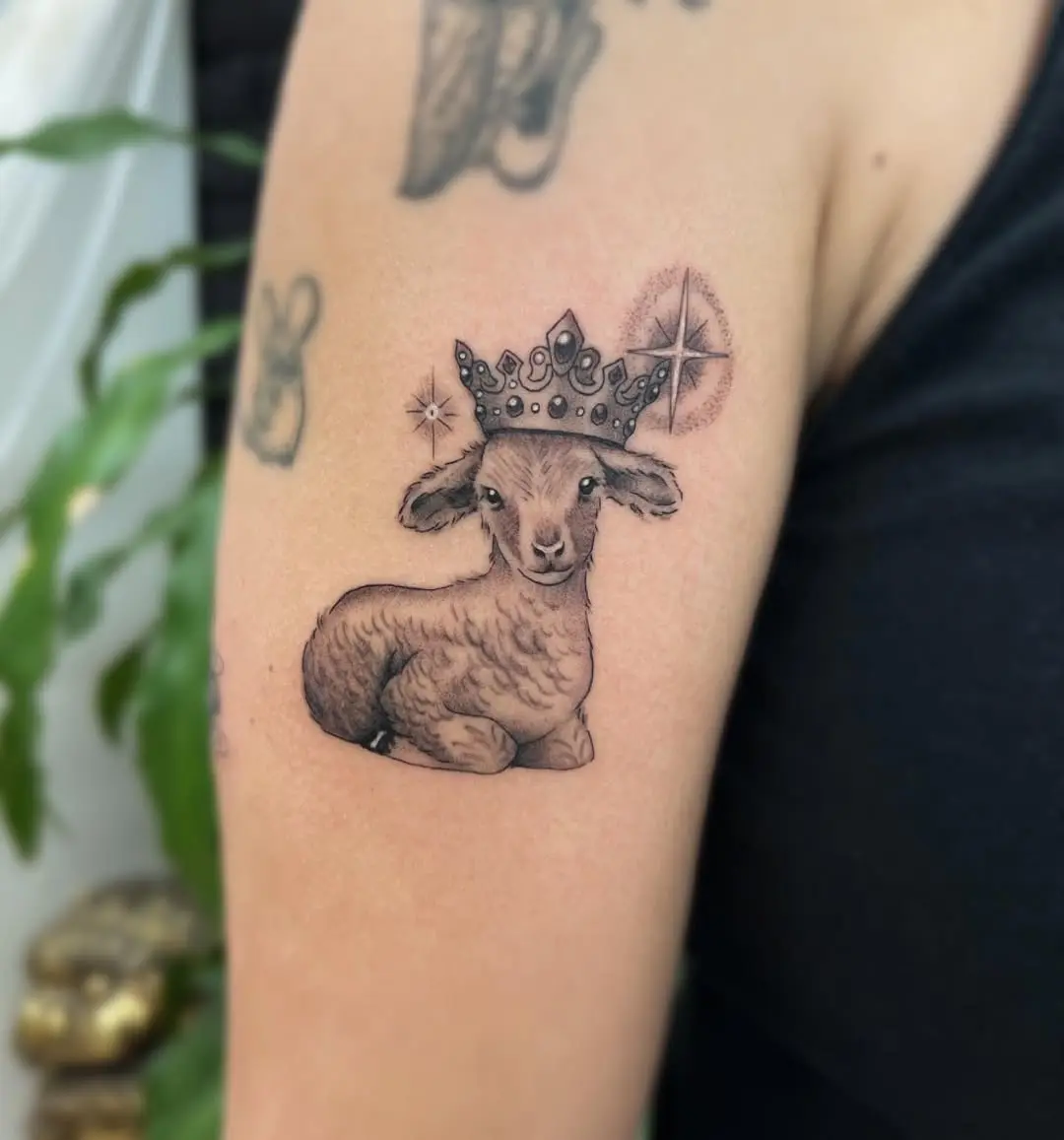 Charming crowned lamb tattoo design on arm