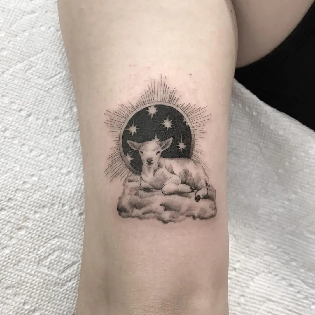 Charming lamb tattoo with celestial elements