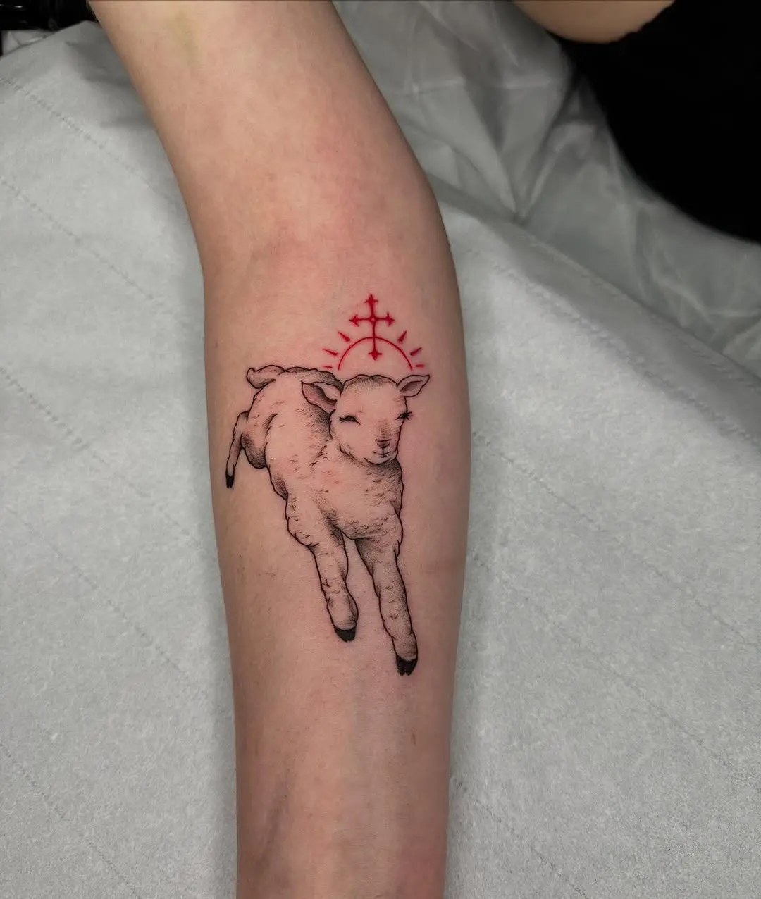 A joyful lamb tattoo jumping with grace