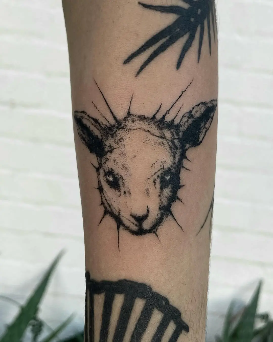 Charming lamb tattoo with intricate detailing