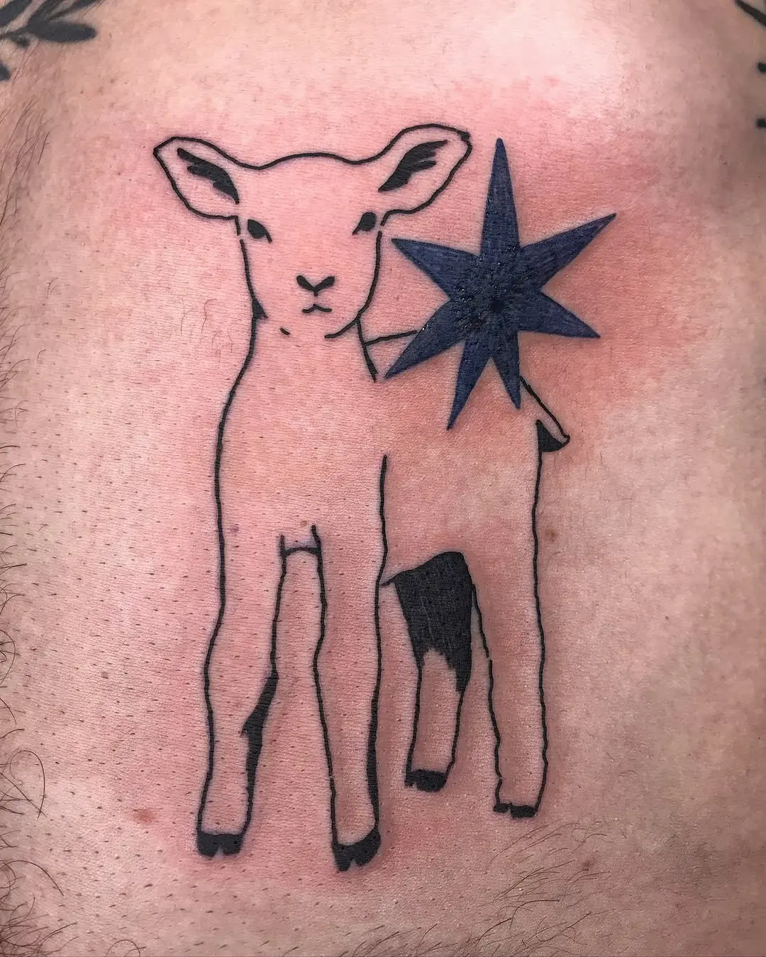 Charming lamb tattoo with striking star element