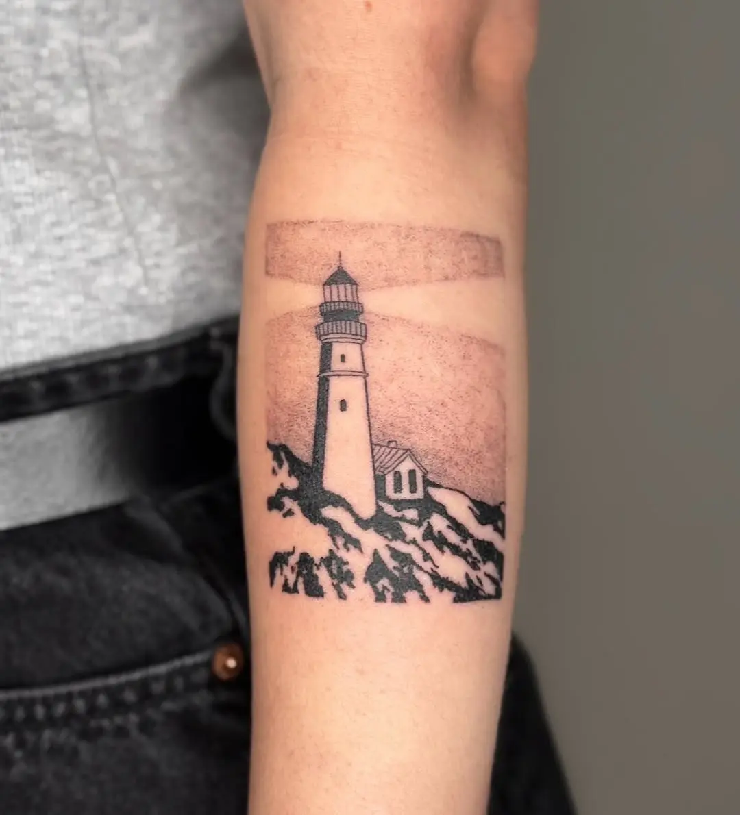 Elegant lighthouse tattoo set against a serene sky