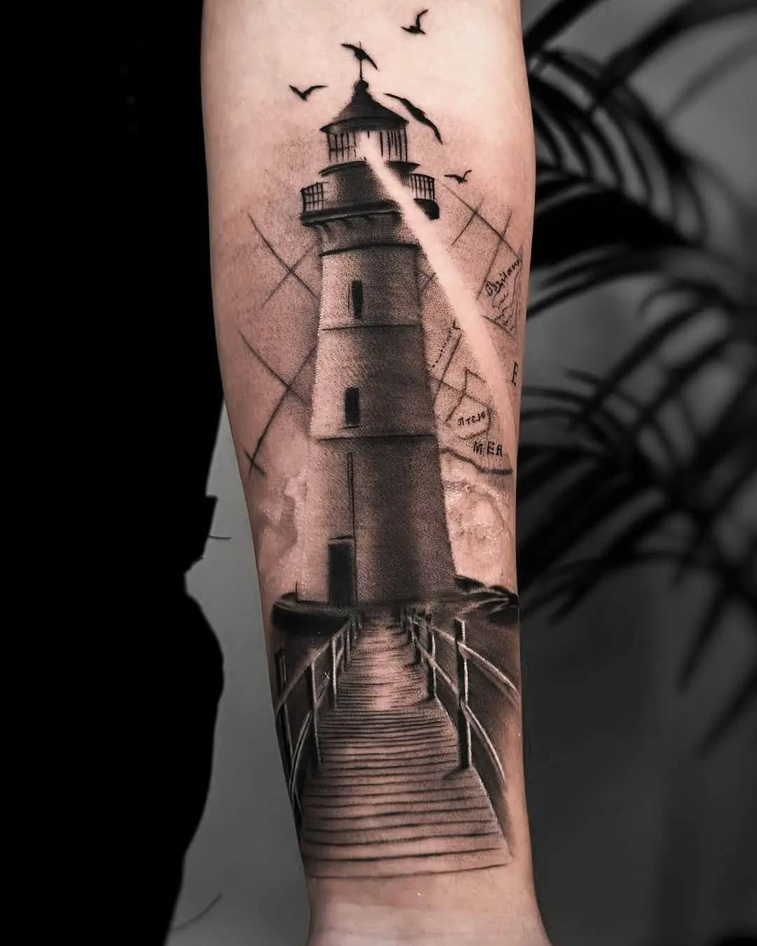 Intricate lighthouse tattoo with realistic details
