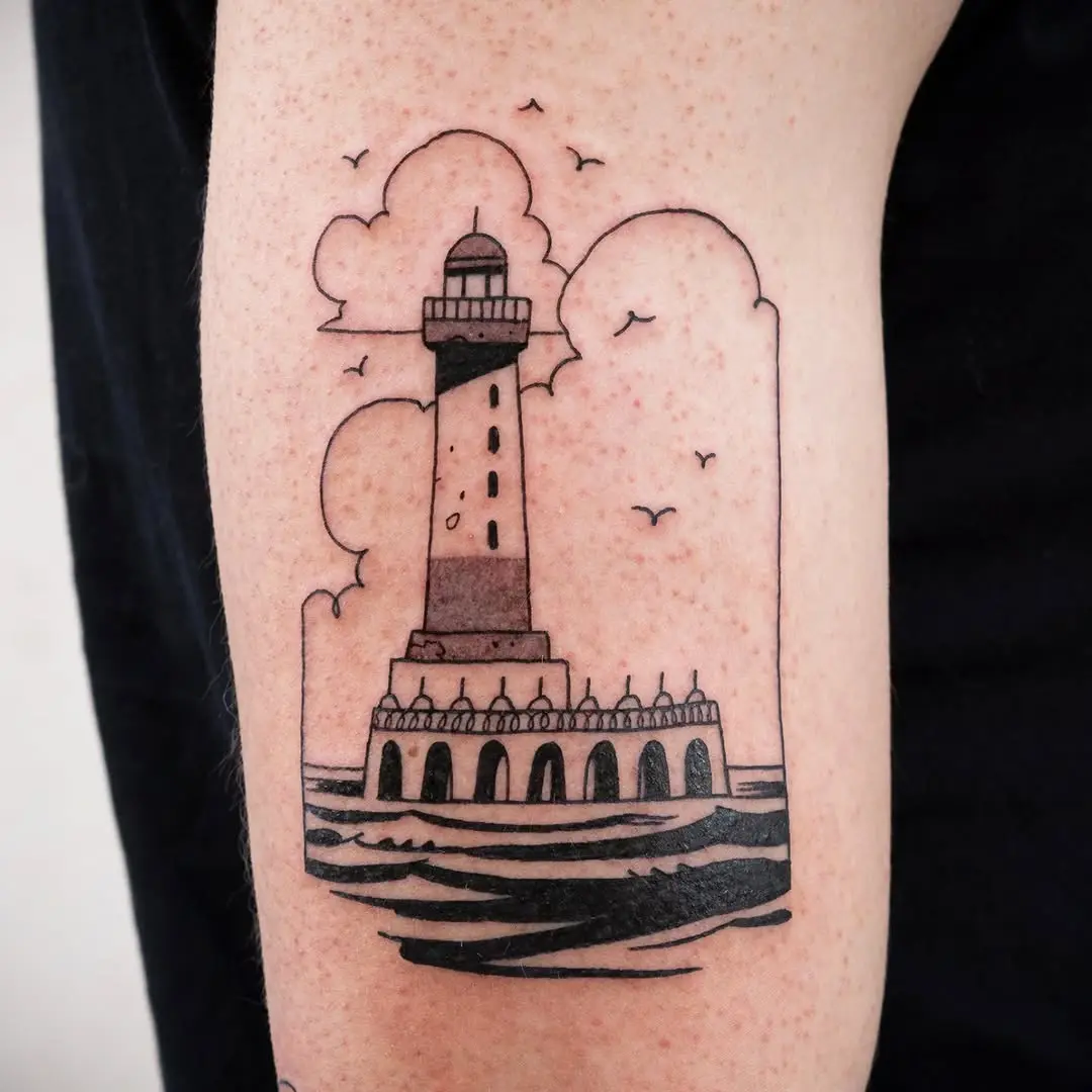 Stunning minimalist lighthouse tattoo with waves