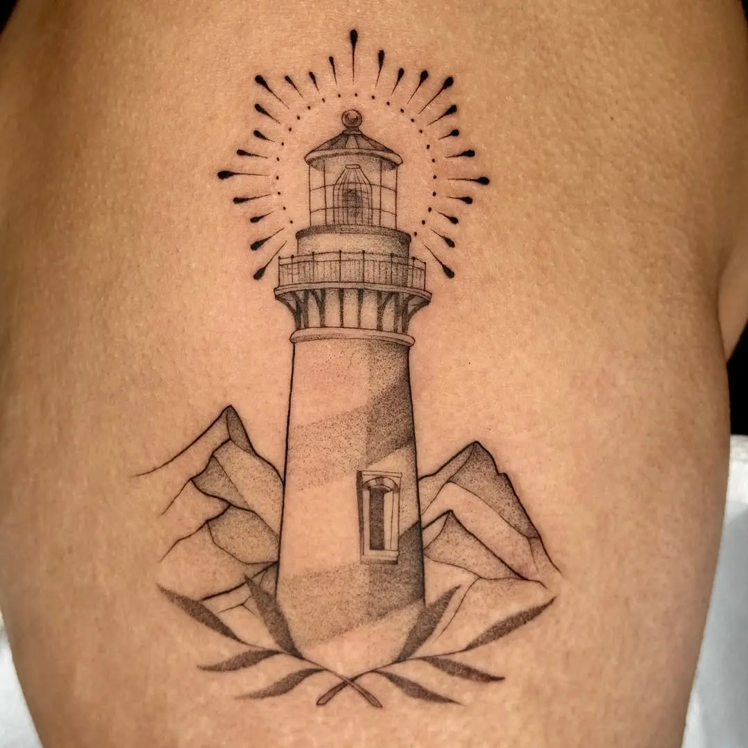 Elegant lighthouse tattoo with mountain elements