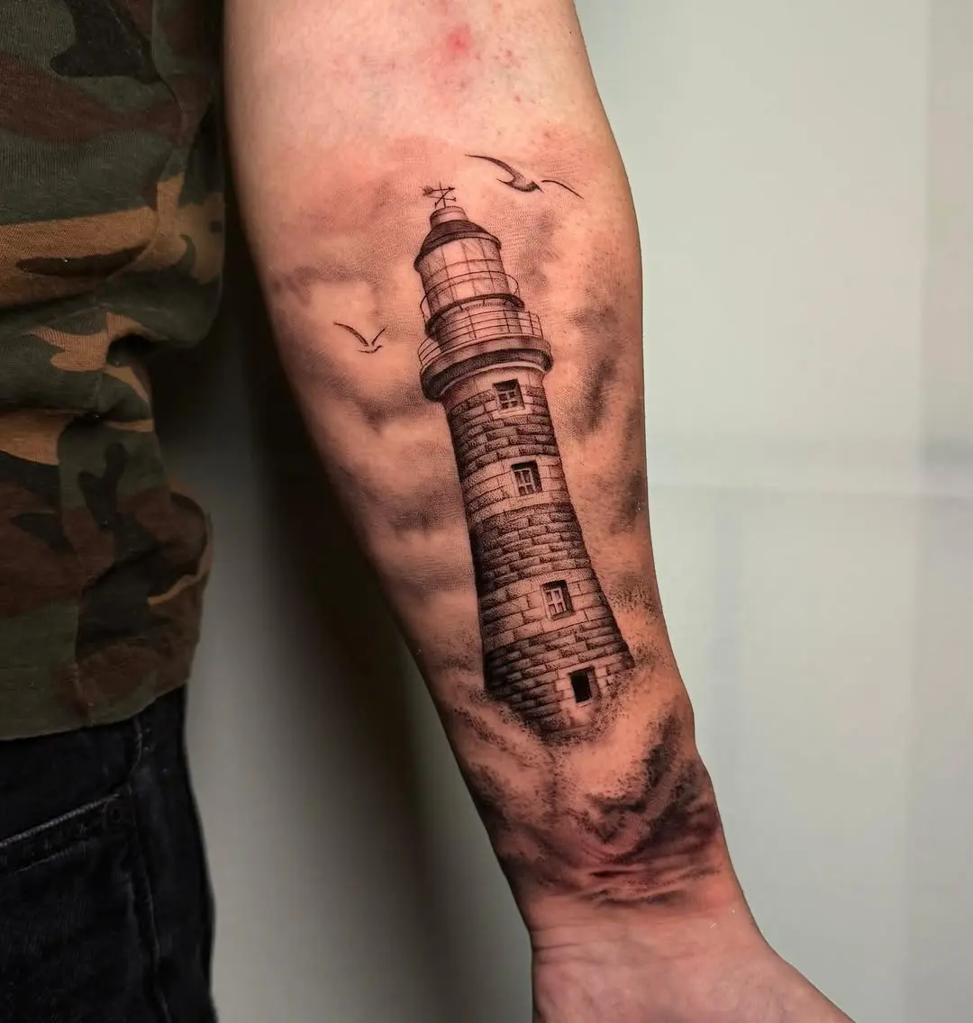 Stunning lighthouse tattoo with intricate details