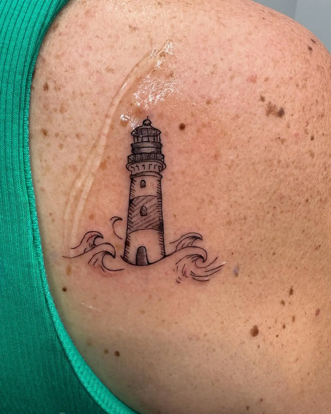 A stunning lighthouse surrounded by gentle waves.