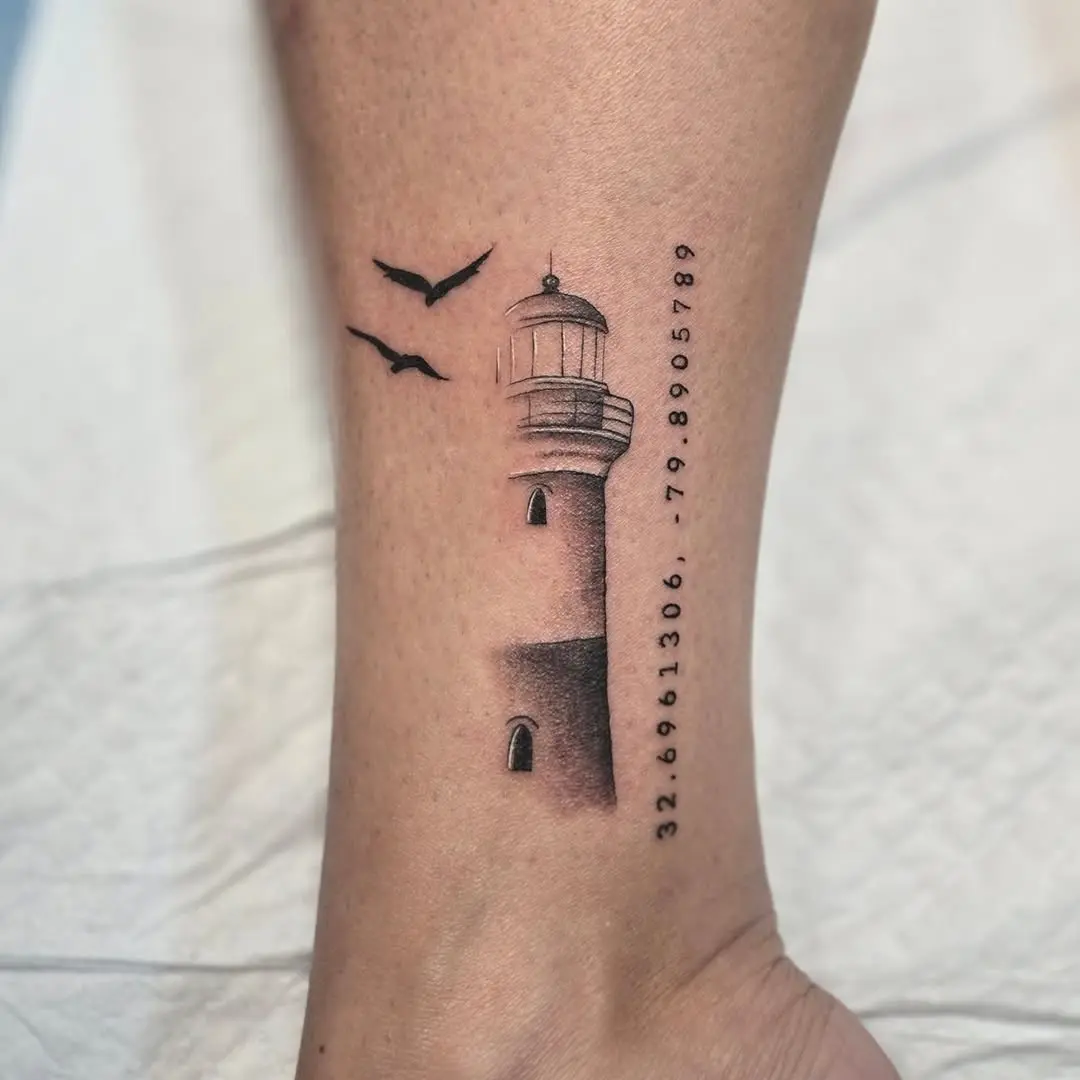 Stylish lighthouse tattoo with serene details