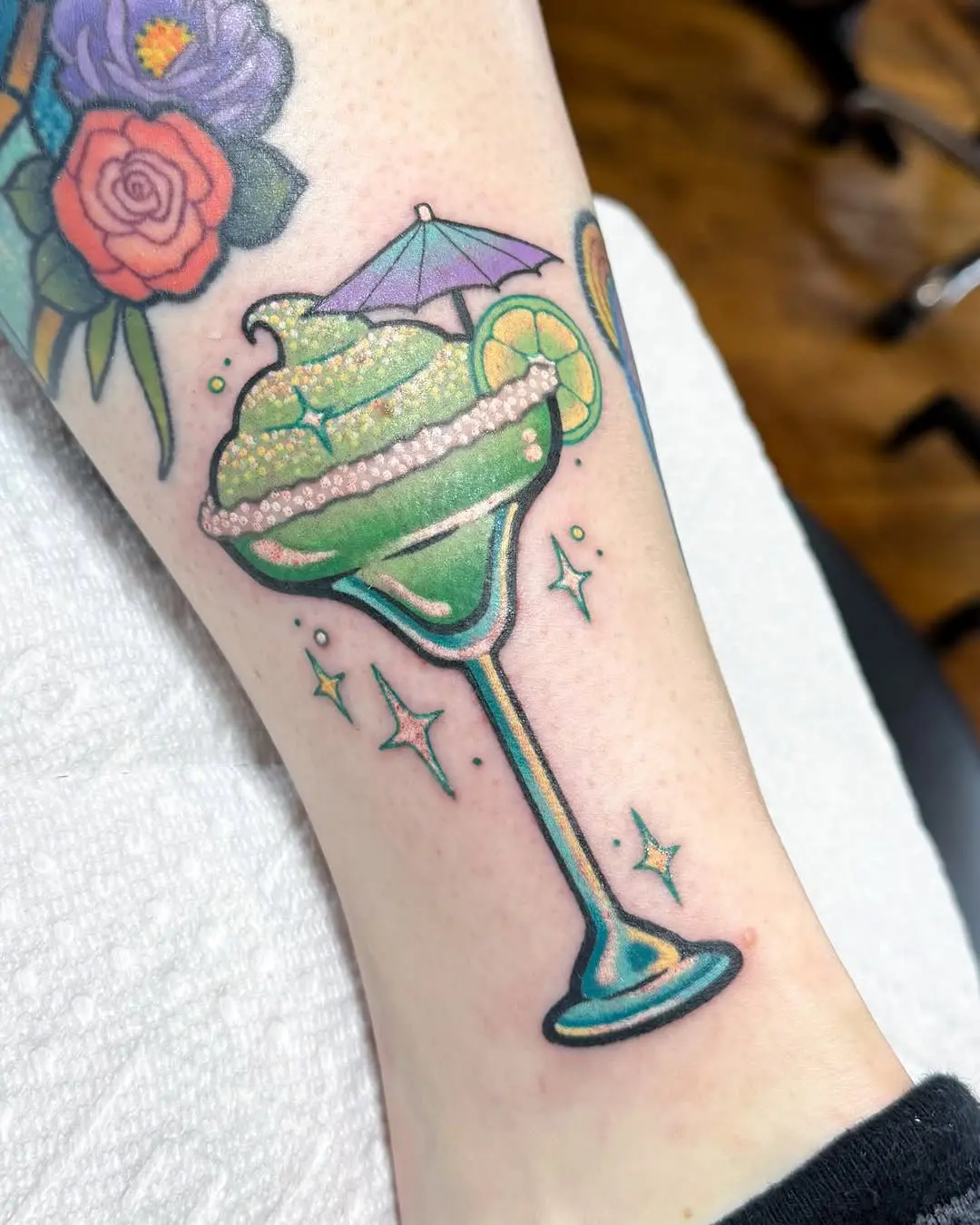 Vibrant margarita tattoo with whimsical details