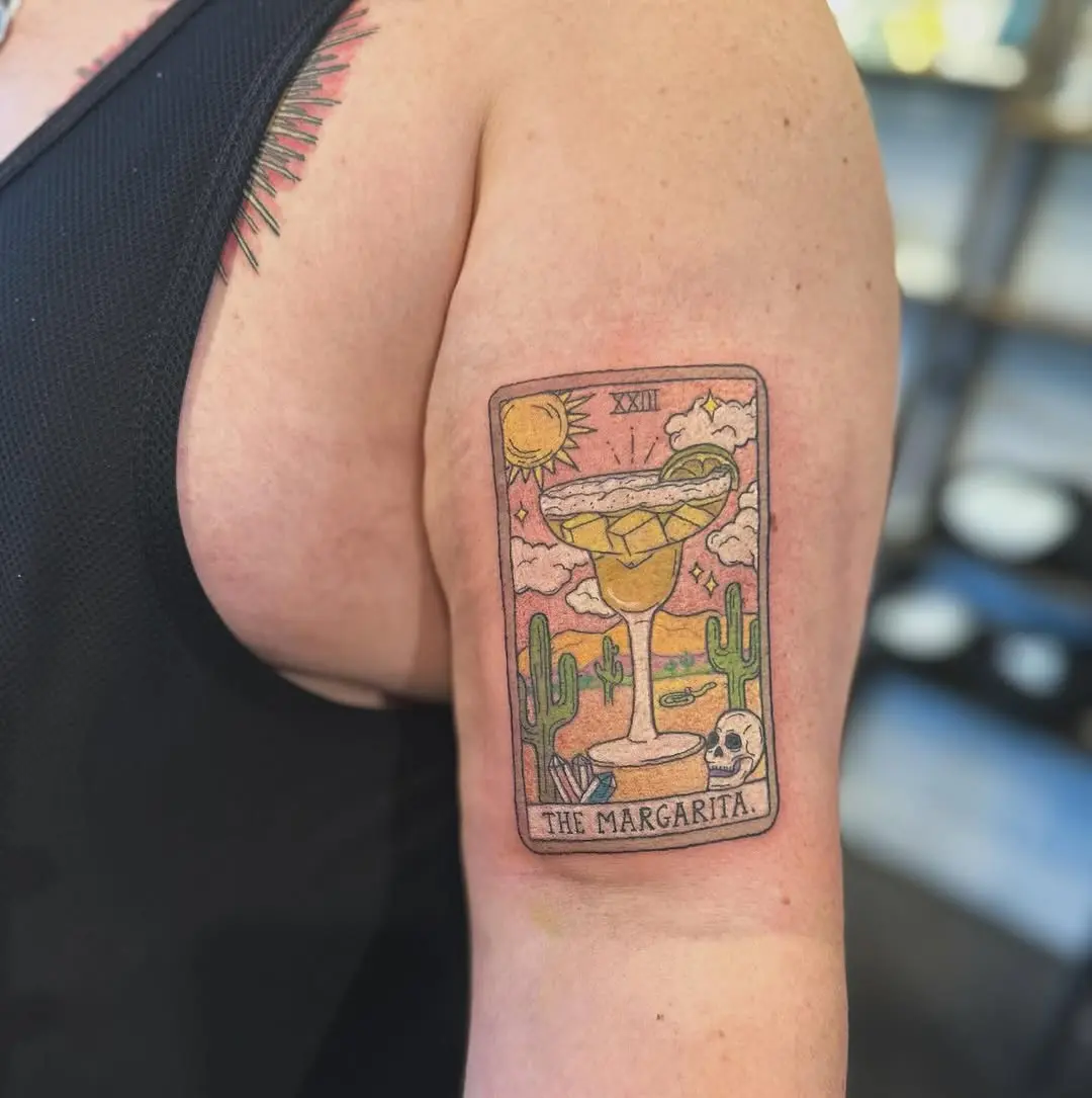 Whimsical margarita tattoo with desert elements