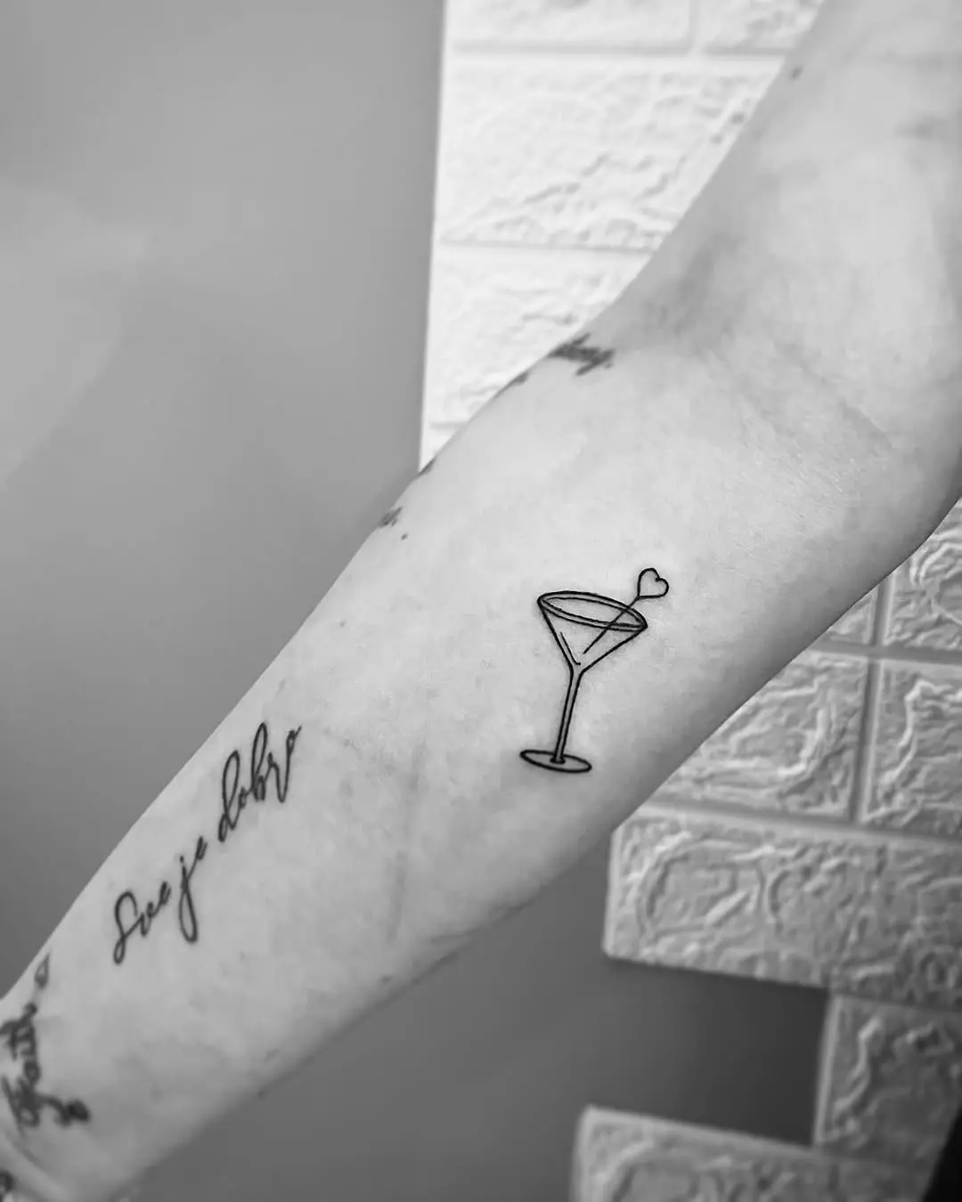 Minimalist margarita glass tattoo design for enthusiasts
