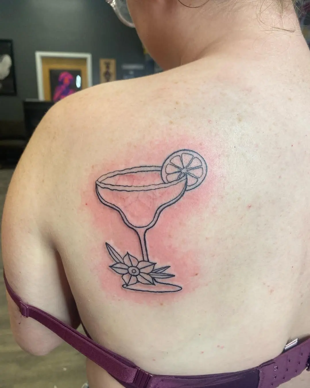 Elegant margarita tattoo on the shoulder
