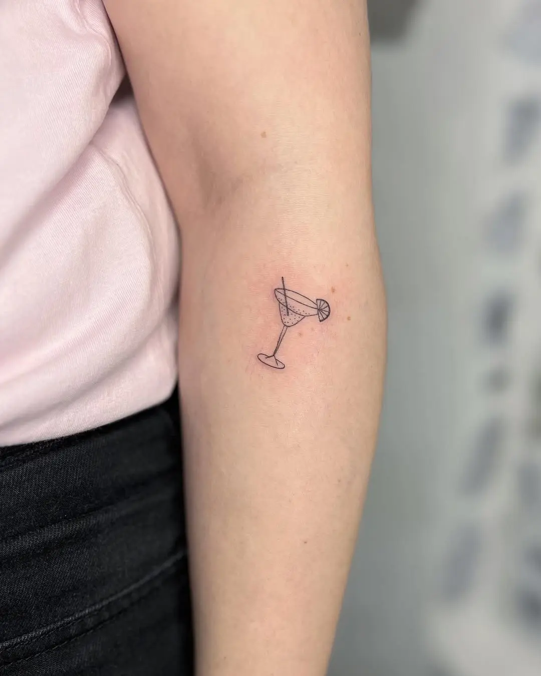 Stylish margarita tattoo on elbow