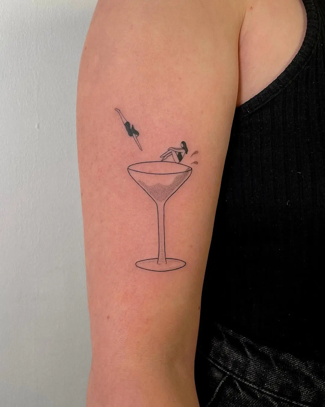 Playful margarita tattoo with a swimmer