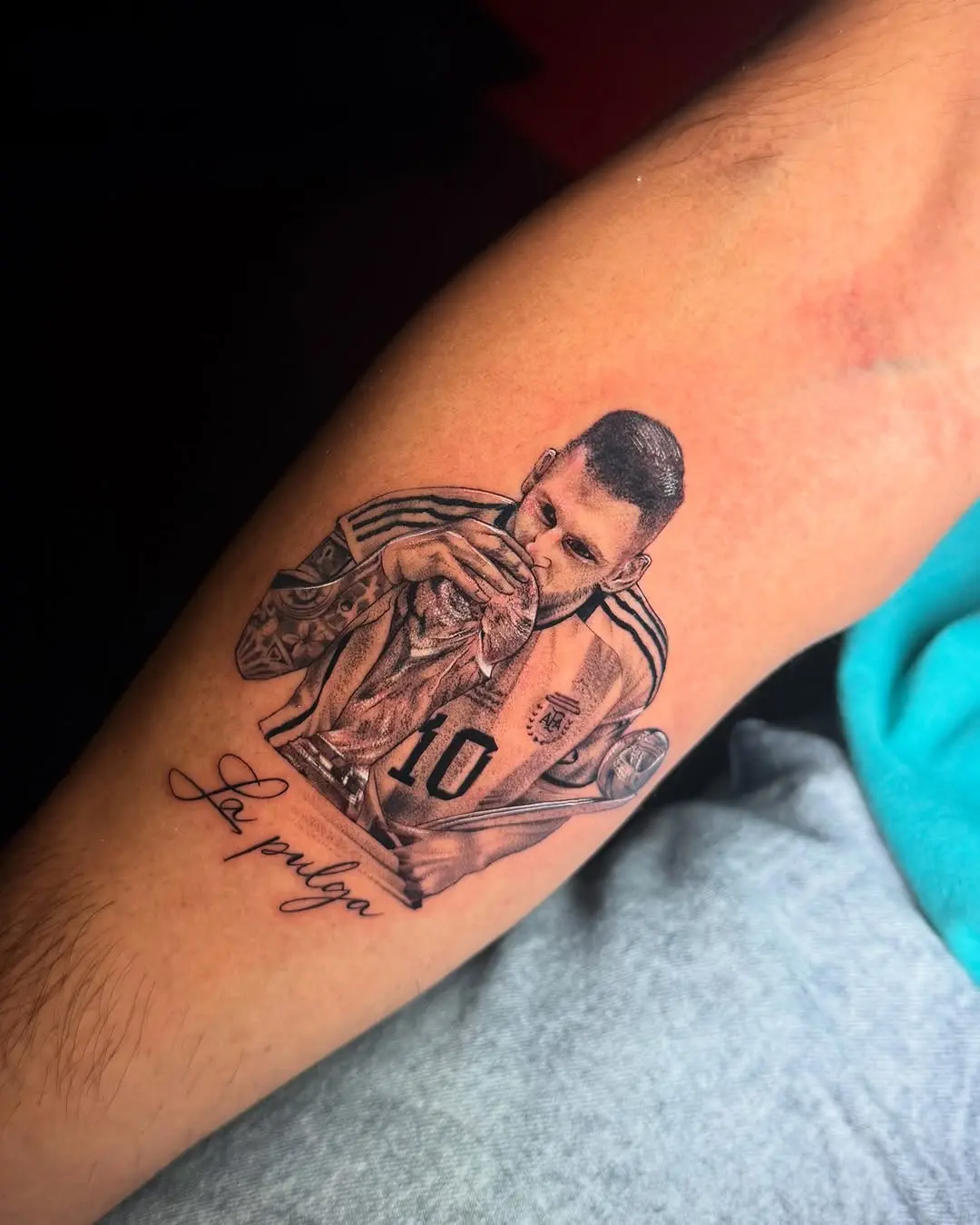 Lionel Messi celebrating victory inked on skin